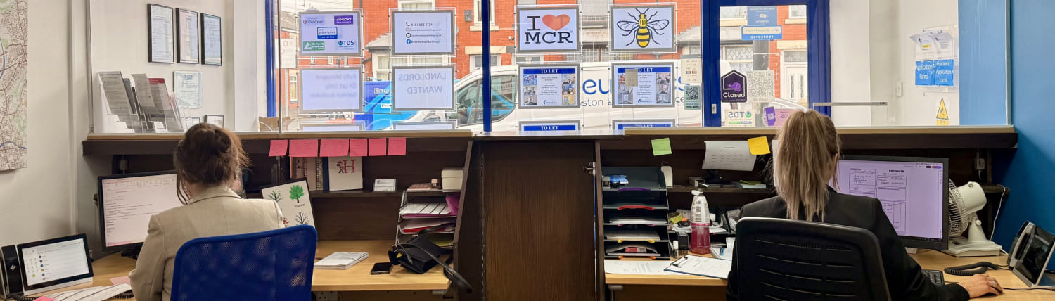 hand with keys in a room with boxes
