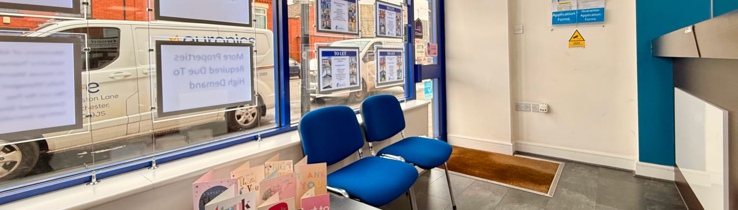 hand with keys in a room with boxes